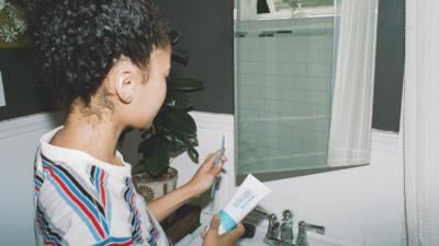 girl brushing teeth with Schmidt's